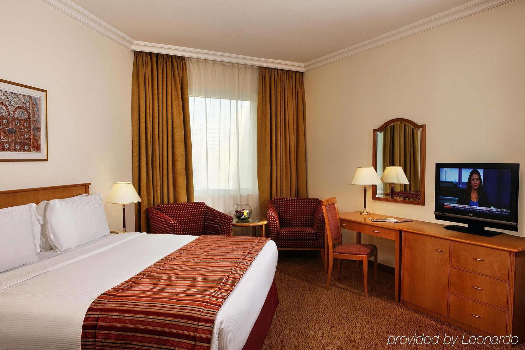 Swiss-Belhotel Sharjah Quarto foto